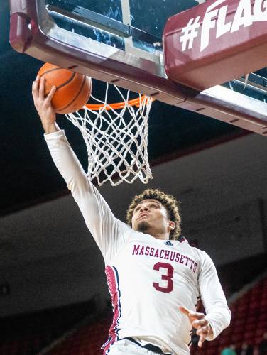 UMass guard Marqui Worthy (3) attempts a layup during a game against Davidson at the Mullins Center earlier this month.