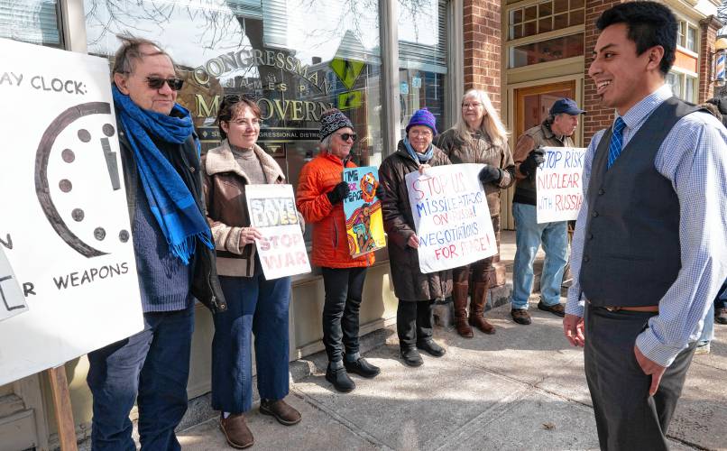 Koby Gardner-Levine, regional manager for U.S. Rep Jim McGovern’s office, talks to members of Massachusetts Peace Action in front of McGovern’s Northampton office. The Monday rally, which coincided with the third anniversary of Russia’s invasion of Ukraine, was called to support peace negotiations in the war. 