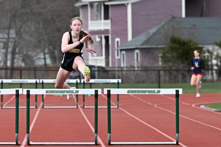 Pioneer’s Emmanuelle Flagollet wins the 400 meter hurdles at Greenfield High School earlier this season. 