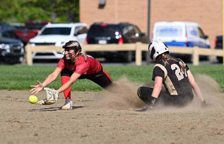 Athol’s Giana Vaillancourt waits for the throw as Pioneer’s Greta Lewis takes second in Northfield on Tuesday. 