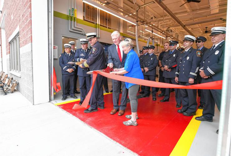 Officials cut the ribbon at the grand opening of the new Greenfield Fire Station on Monday morning in Greenfield. 