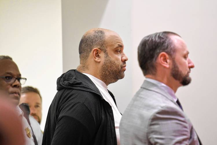 Taaniel Herberger-Brown, center, is arraigned in Greenfield District Court on Tuesday morning with his defense attorney Nicholas Horgan, at right.