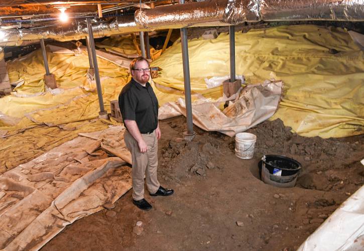 Ashfield Town Administrator Paul McLatchy III in the dirt floor section of the basement of the Ashfield Town Hall.