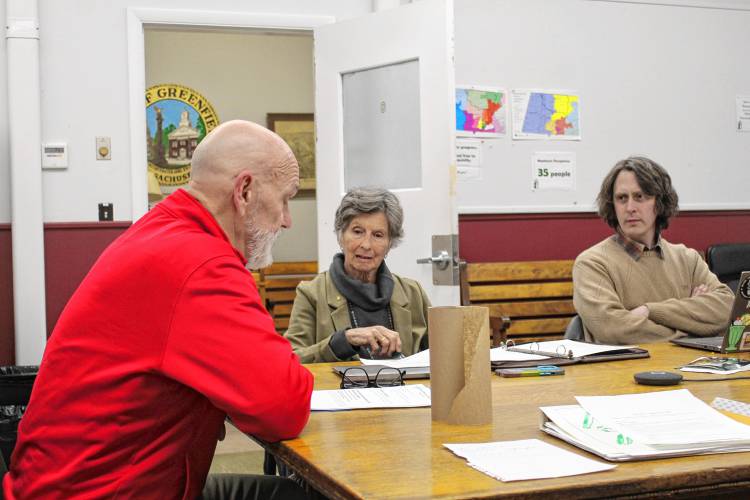 Franklin County’s YMCA CEO Grady Vigneau, in red, presents plans to bring the former Zion Korean Church back to its hometown of Barre during the Greenfield Historical Commission meeting on Thursday evening.