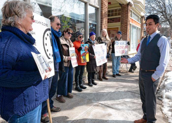 Koby Gardner-Levine, regional manager for U.S. Rep Jim McGovern’s office, talks to members of Massachusetts Peace Action in front of McGovern’s Northampton office. The Monday rally, which coincided with the third anniversary of Russia’s invasion of Ukraine, was called to support peace negotiations in the war. 