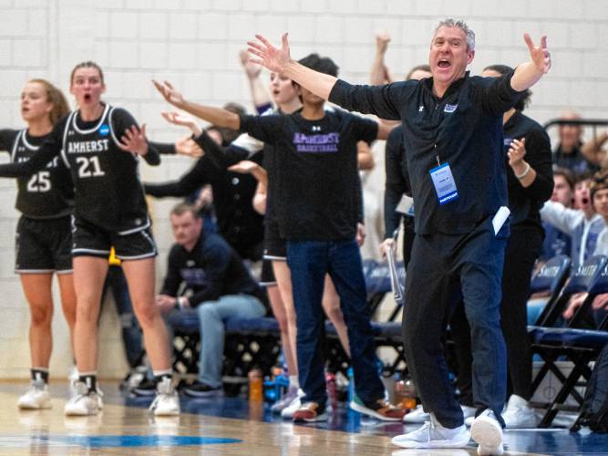Amherst Head Coach G.P. Gromacki and the team bench erupt after a foul was called during the NCAA Division 3 Women's Basketball tournament Round of 32 game against Smith at Ainsworth Gym, Saturday.