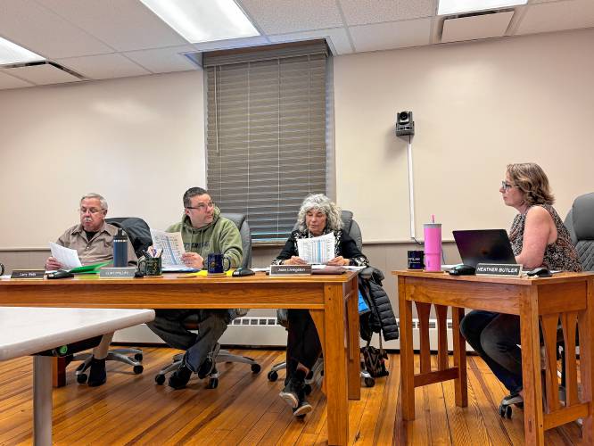 Town Administrator Heather Butler, at right, speaks with Selectboard members Larry Wells, Clint Phillips and Joan Livingston on Tuesday.