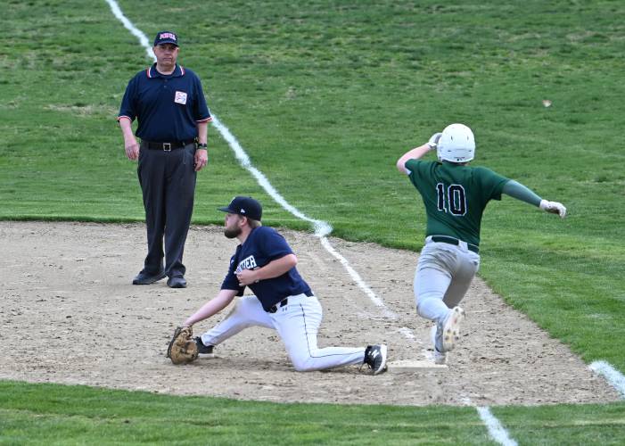 Frontier’s Porter Hall gloves the ball for the out on Greenfield’s Chase Zraunig at Veterans Field in Greenfield on Thursday. 