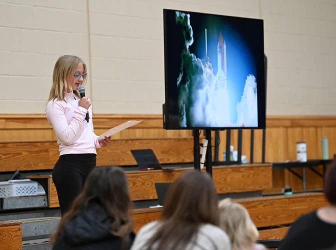 Amy VanDoren, an alumna of the Bernardston Elementary School now at Pioneer Valley Regional School, speaks at a ceremony highlighting her efforts to bring a Moon Tree to the school. Moon Trees are from seeds flown in space.