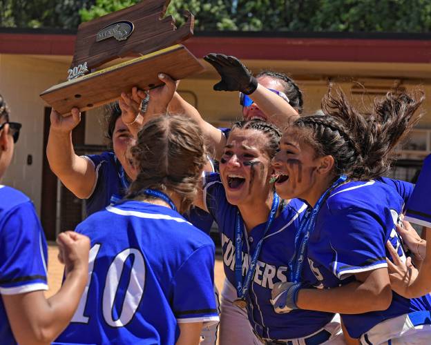 Turners Falls players celebrate after receiving the state title trophy followin the Thunder’s 5-0 win over Georgetown in the MIAA Division 5 championship game on Saturday at Sortino Field on the campus of UMass.