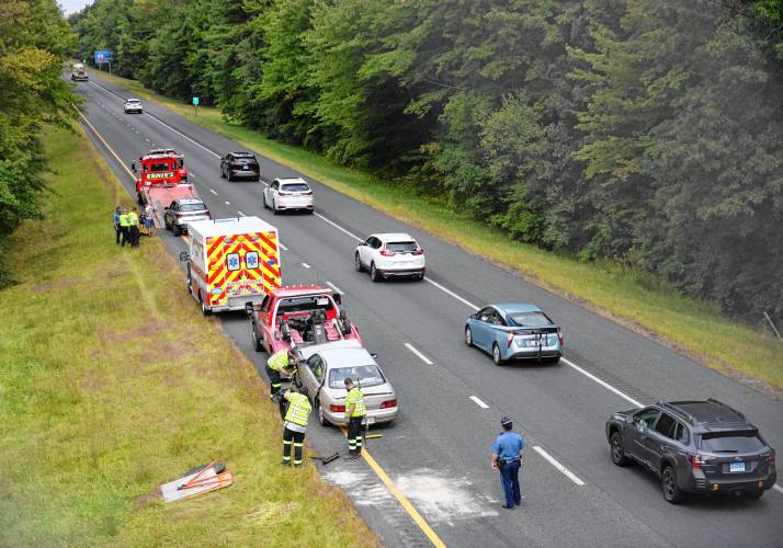 Massachusetts State Police, Whately Fire Department personnel, an ambulance and tow trucks on the scene of a multi-vehicle crash on Interstate 91 northbound in Whately near the Hatfield line.