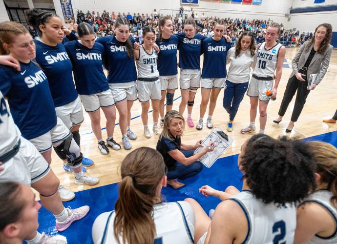 Smith Head Coach Lynn Hersey talks to the team during the NCAA Division 3 Women's Basketball tournament Round of 32 game against Amherst at Ainsworth Gym, Saturday.
