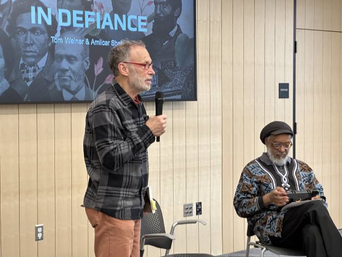 The Friends of the Greenfield Public Library and Racial Justice Rising welcomed the community to “In Defiance: 20 Abolitionists You Were Never Taught In School,” a book presentation by co-authors Tom Weiner, left, and Amilcar Shabazz, right, at the Greenfield Public Library on Wednesday, April 16. Weiner is a Northampton-based writer, educator and activist, and Shabazz is a professor and former president of the National Council for Black Studies.